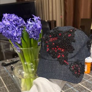 Elegant Black Cap with Red Embellishments , New